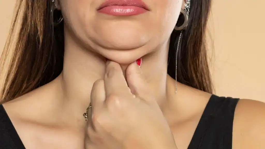 An image of a woman with double chin, sad, worried : Non Surgical Double Chin Removal Treatment in Sunderland, UK